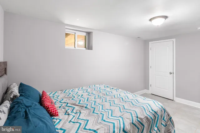 a kitchen with a refrigerator and a stove top oven
