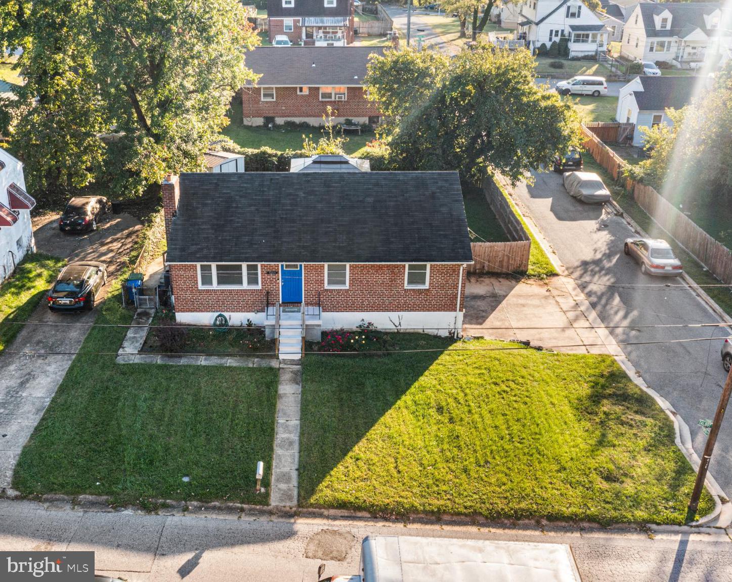 5219 West North Avenue Baltimore, MD 21207 - Photo 2 of 34 Charming home with lush green surroundings.