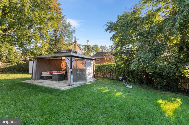 an aerial view of residential houses with yard