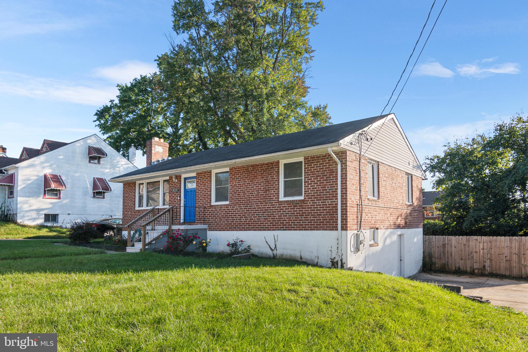 5219 West North Avenue Baltimore, MD 21207 - Photo 27 of 34 Charming brick home with lush green yard.