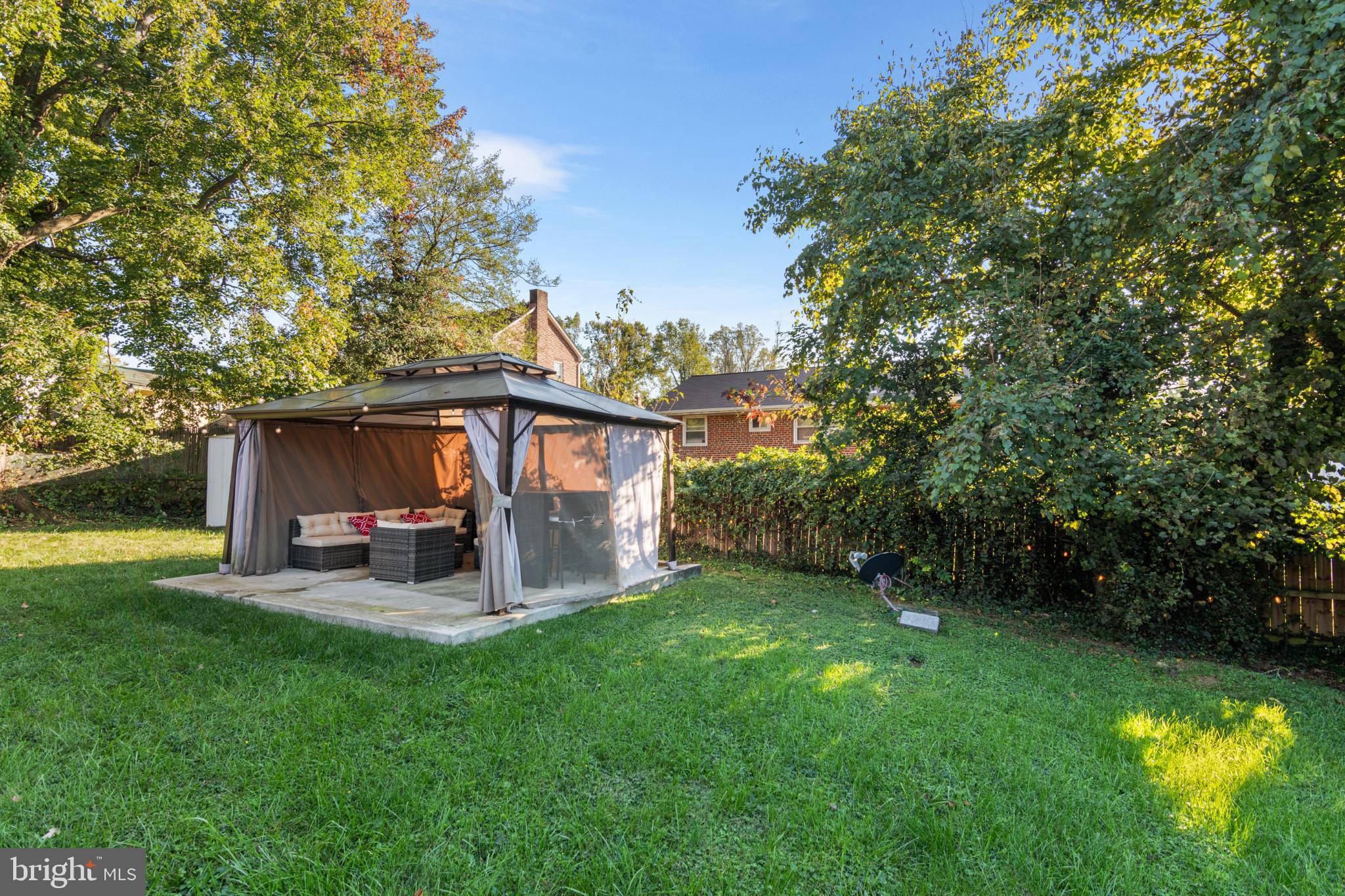 5219 West North Avenue Baltimore, MD 21207 - Photo 30 of 34 Serene backyard retreat with lush greenery.