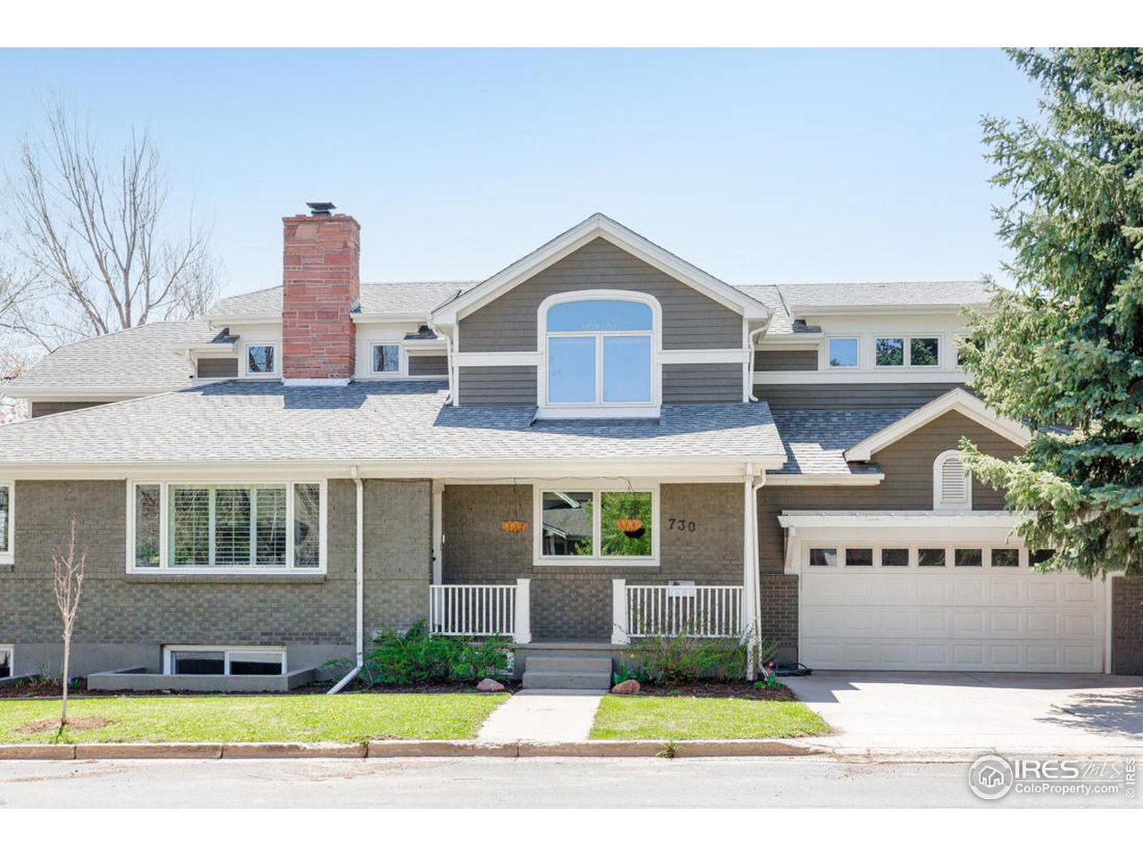 730 Evergreen Avenue Boulder, CO 80304 - Photo 1 of 33 a front view of a house with a yard and garage
