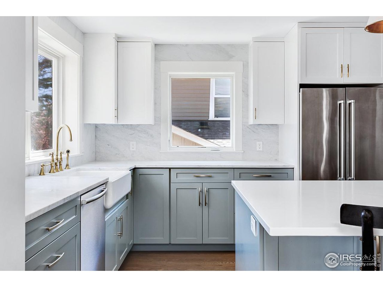 730 Evergreen Avenue Boulder, CO 80304 - Photo 11 of 33 a kitchen with a sink dishwasher a refrigerator and cabinets with wooden floor