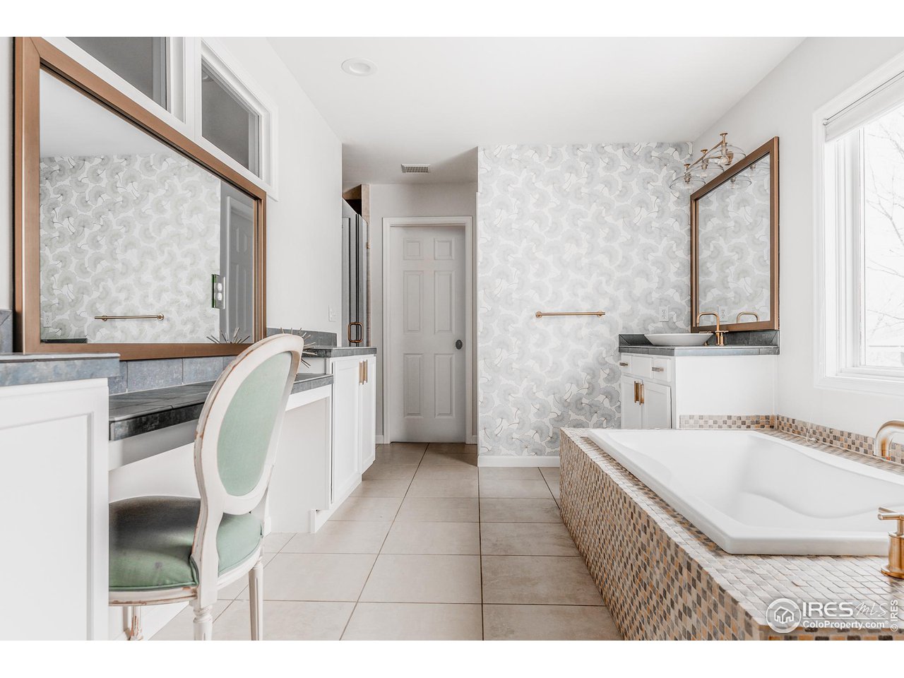 730 Evergreen Avenue Boulder, CO 80304 - Photo 20 of 33 a en suite bathroom with a sink a bathtub and a mirror