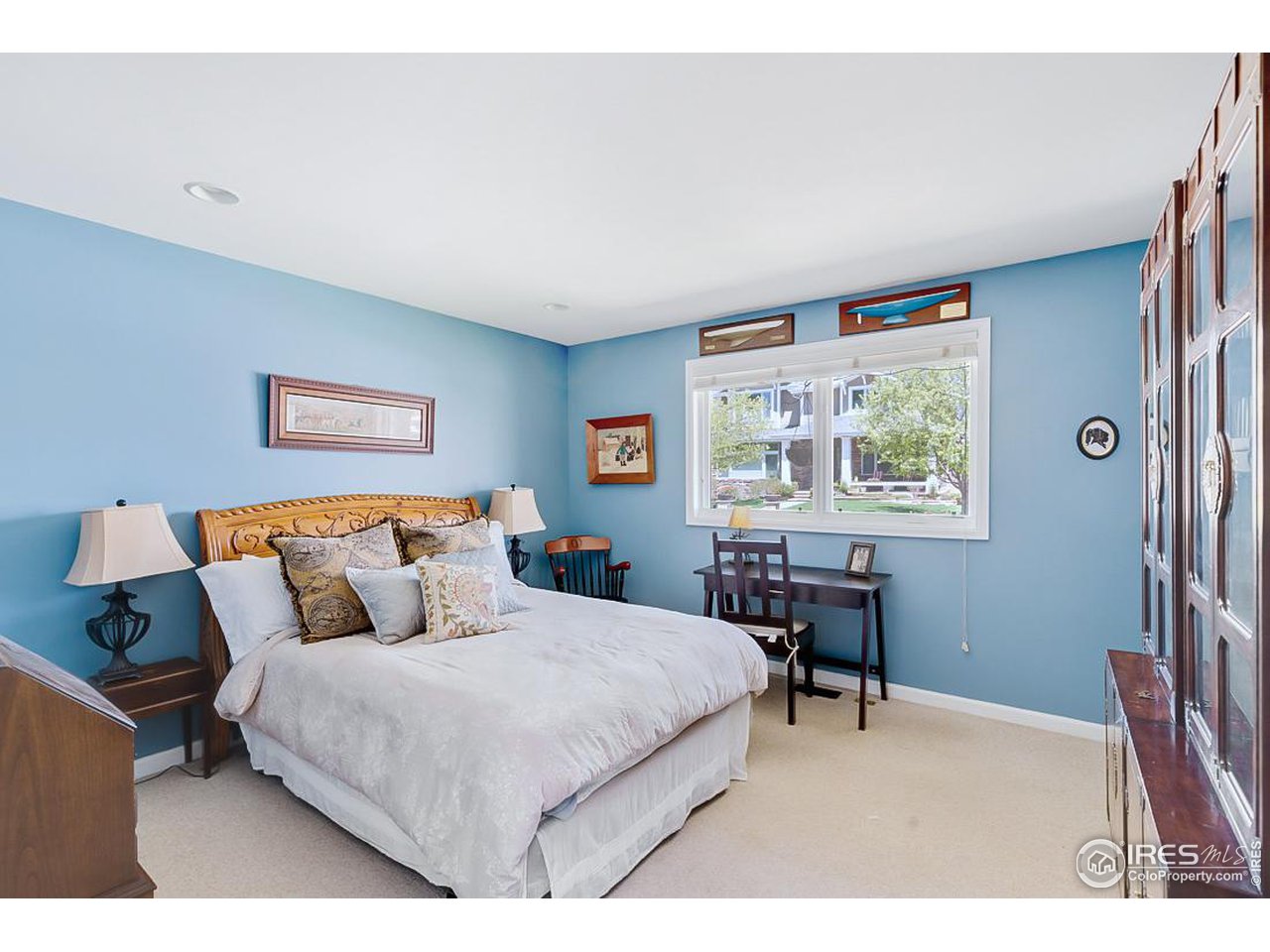730 Evergreen Avenue Boulder, CO 80304 - Photo 22 of 33 a bedroom with a bed a table and a window