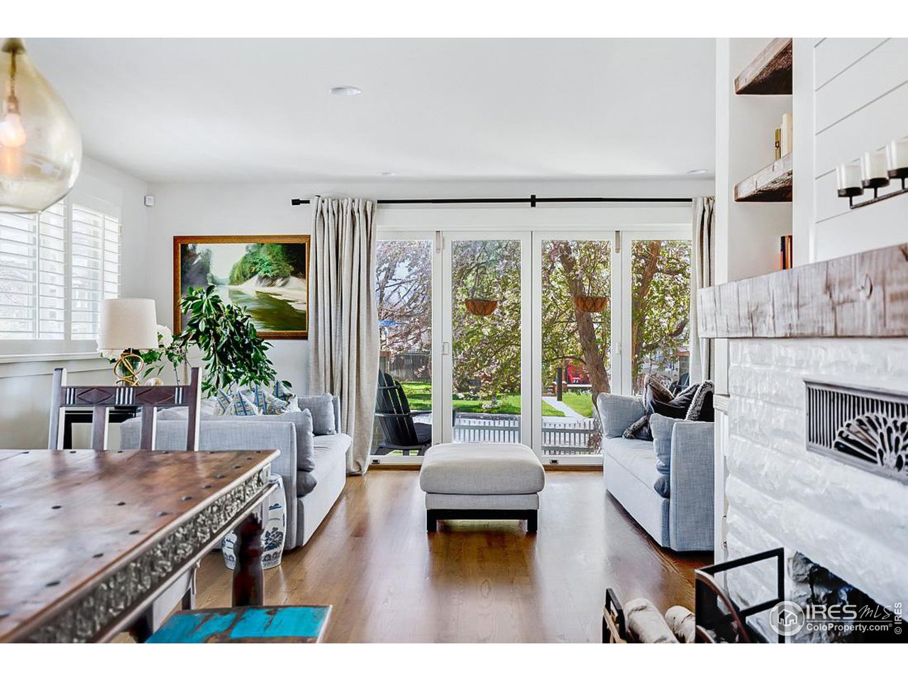 730 Evergreen Avenue Boulder, CO 80304 - Photo 8 of 33 a living room with furniture large window and wooden floor