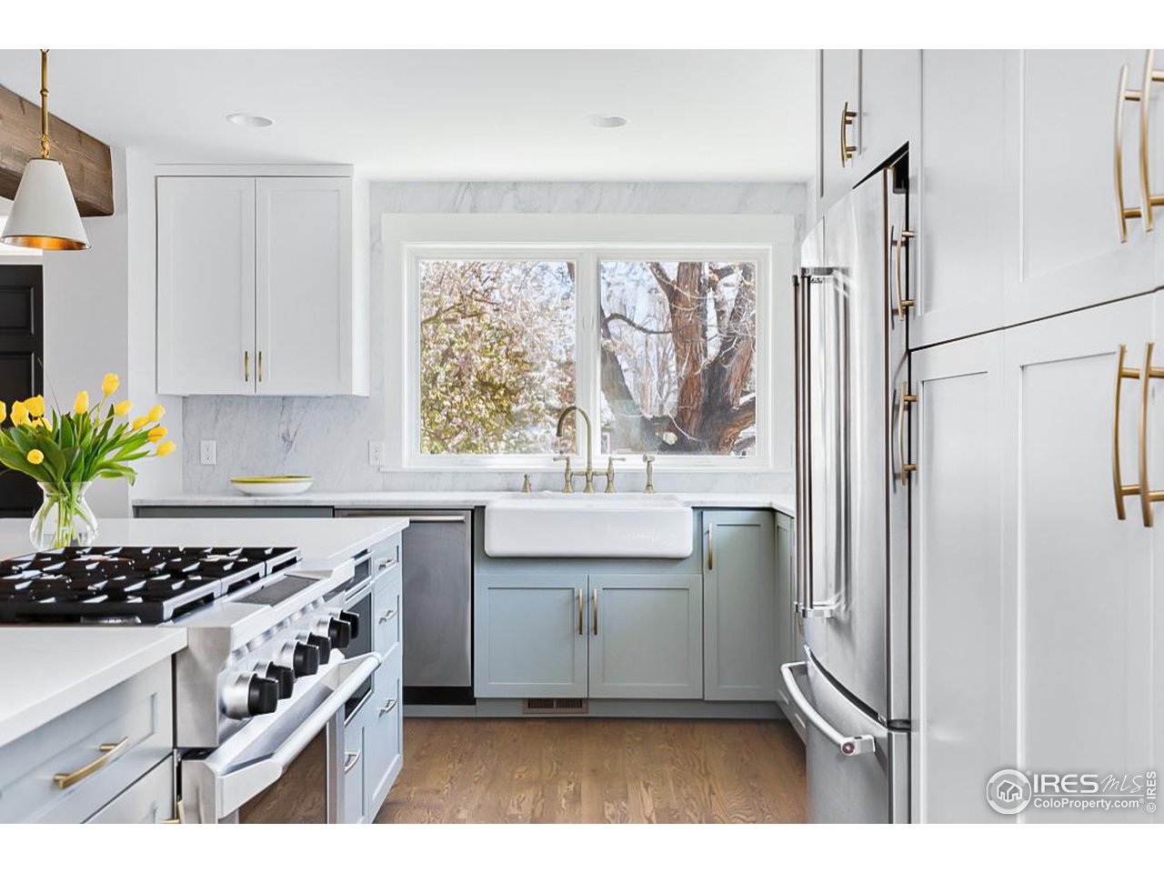 730 Evergreen Avenue Boulder, CO 80304 - Photo 10 of 33 a kitchen with a stove a sink and a refrigerator