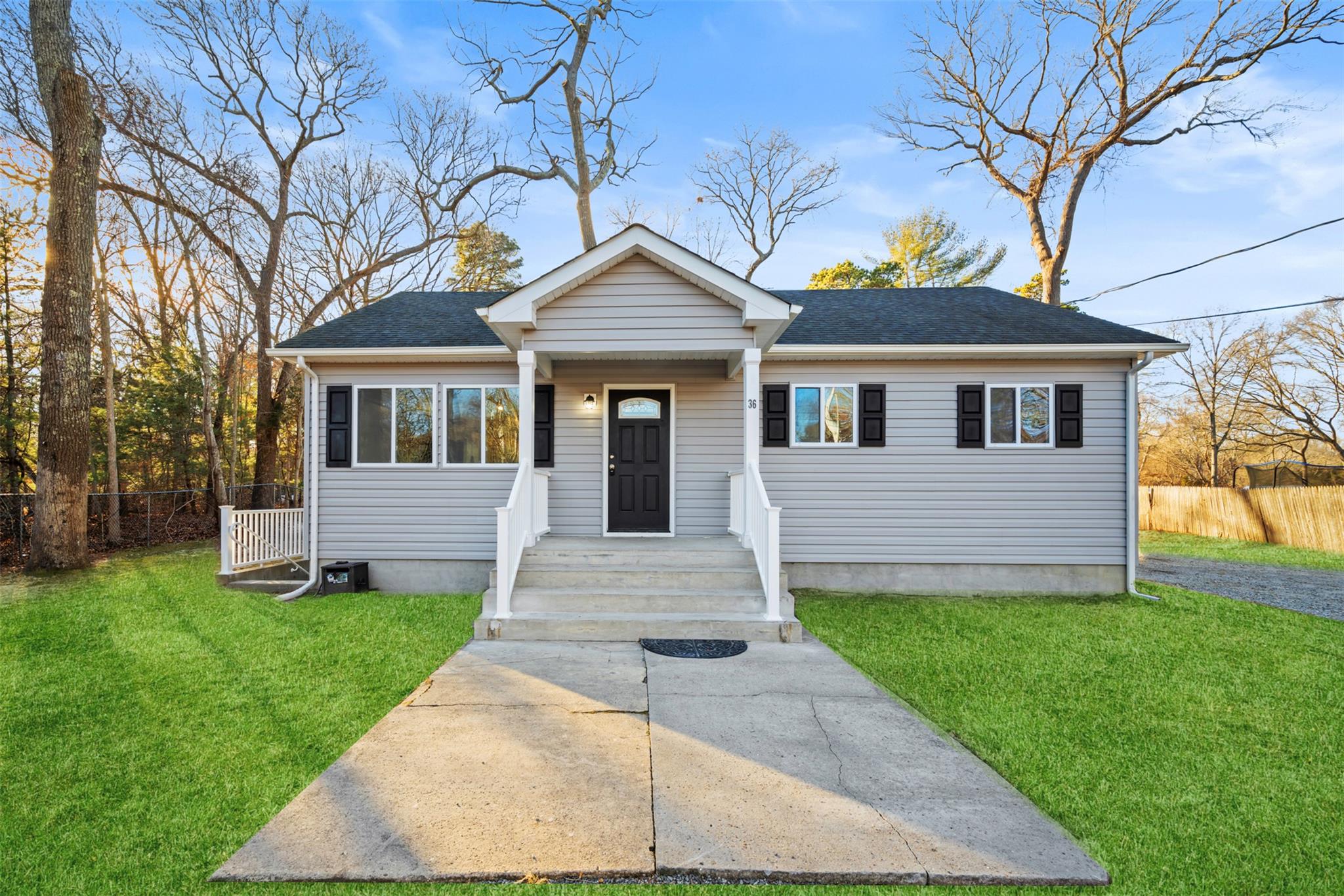 36 Wellington Road Middle Island, NY 11953 - Photo 1 of 1 Bungalow-style home with a front yard