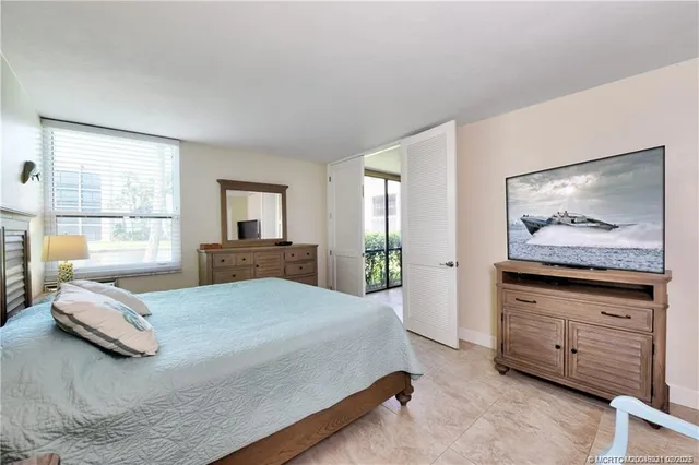 a bedroom with a bed and dresser