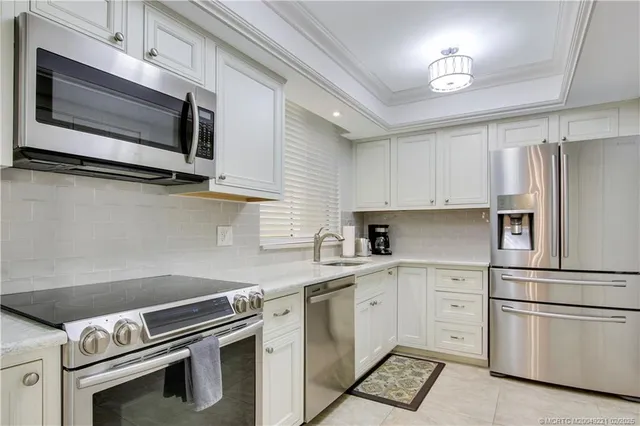a kitchen with a stove microwave and refrigerator