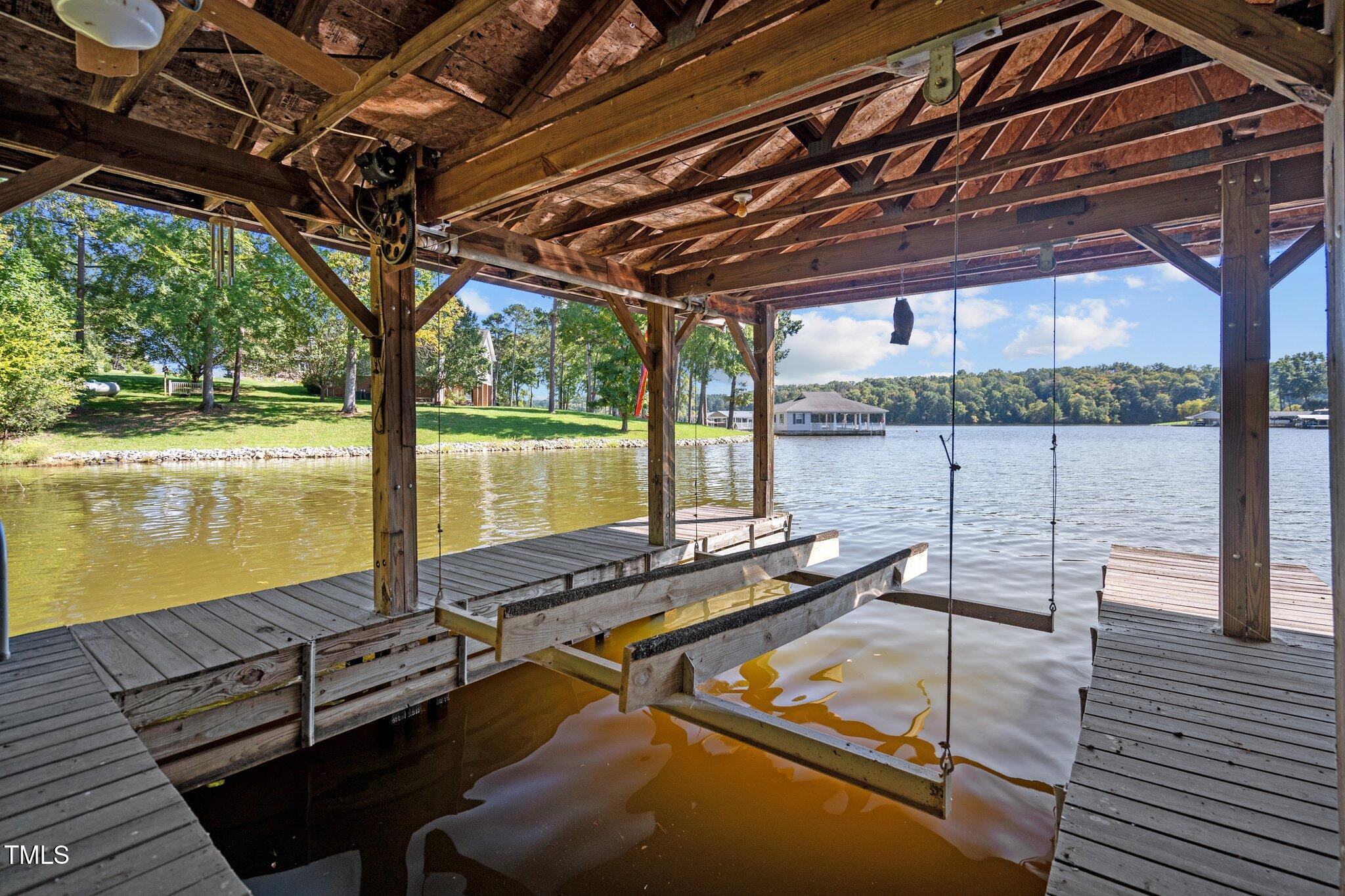 395 Velvet Road Semora, NC 27343 - Photo 9 of 22 Boat slip of the dock with electric lift