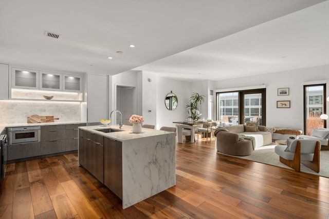 a view of kitchen with sink and living room