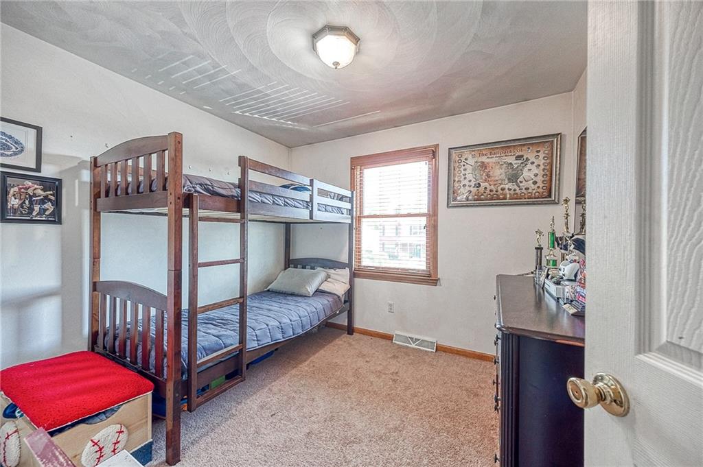 124 Rustic Ridge Drive Pittsburgh, PA 15239 - Photo 11 of 30 a bedroom with furniture and a window