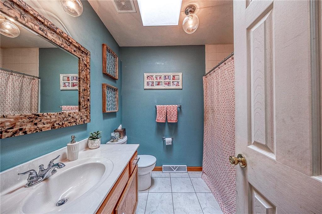 124 Rustic Ridge Drive Pittsburgh, PA 15239 - Photo 15 of 30 a bathroom with a sink and a mirror