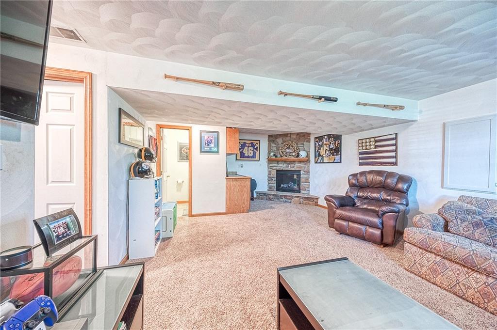 124 Rustic Ridge Drive Pittsburgh, PA 15239 - Photo 17 of 30 a living room with furniture and a flat screen tv