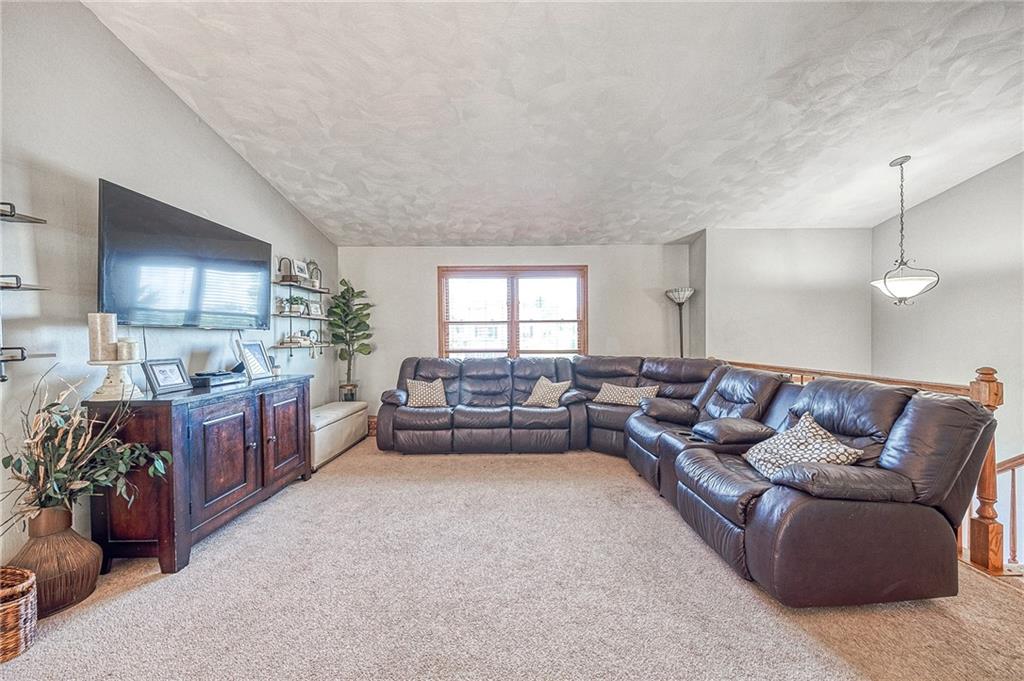 124 Rustic Ridge Drive Pittsburgh, PA 15239 - Photo 2 of 30 a living room with furniture and a flat screen tv