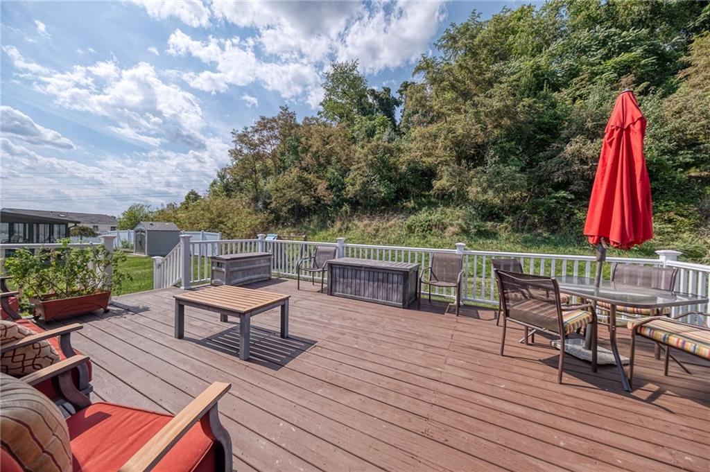 124 Rustic Ridge Drive Pittsburgh, PA 15239 - Photo 22 of 30 a view of a chairs and table on the wooden deck