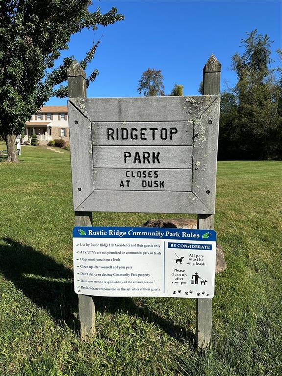124 Rustic Ridge Drive Pittsburgh, PA 15239 - Photo 27 of 30 a view of a sign board with a yard