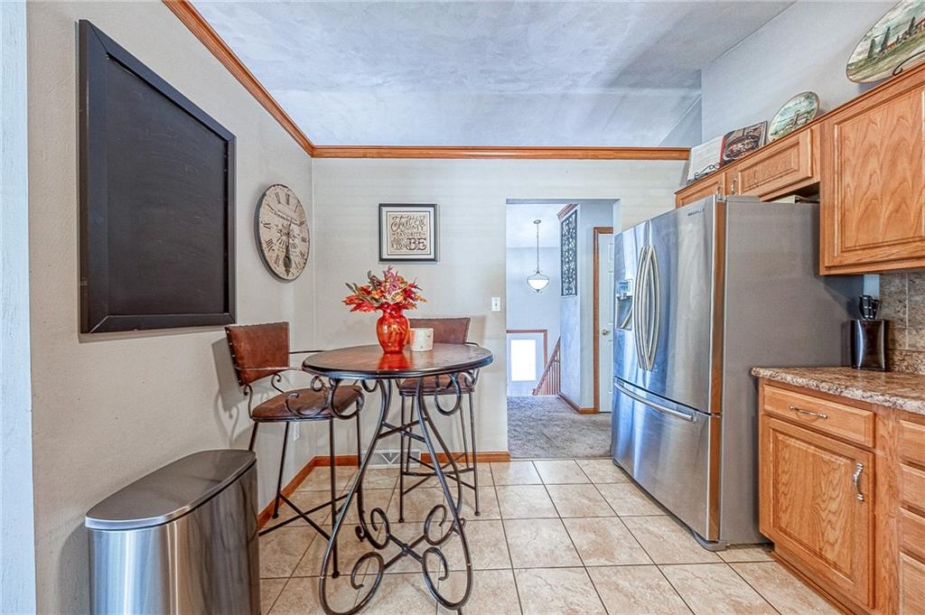 124 Rustic Ridge Drive Pittsburgh, PA 15239 - Photo 7 of 30 a kitchen with stainless steel appliances granite countertop a refrigerator and a stove top oven
