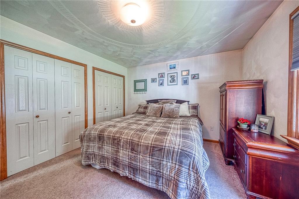 124 Rustic Ridge Drive Pittsburgh, PA 15239 - Photo 8 of 30 a bedroom with a bed and wooden floor