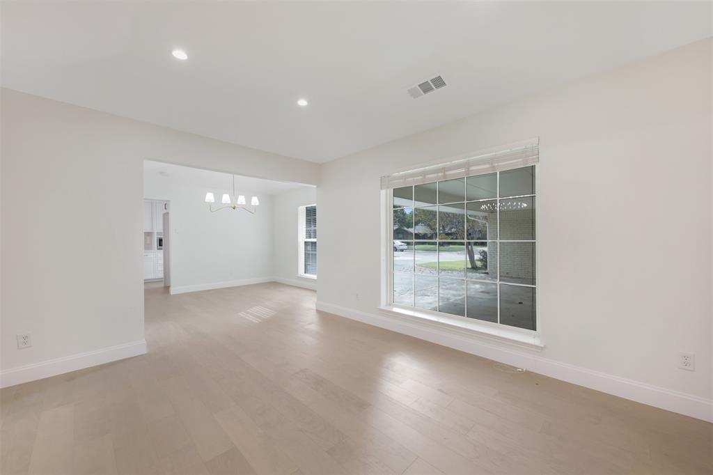 2707 Quail Ridge Drive Carrollton, TX 75006 - Photo 20 of 32 a view of empty room with windows