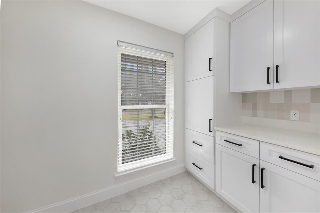 2707 Quail Ridge Drive Carrollton, TX 75006 - Photo 26 of 32 a view of an empty room with a window