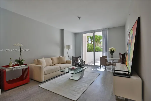 a living room with furniture fireplace and window