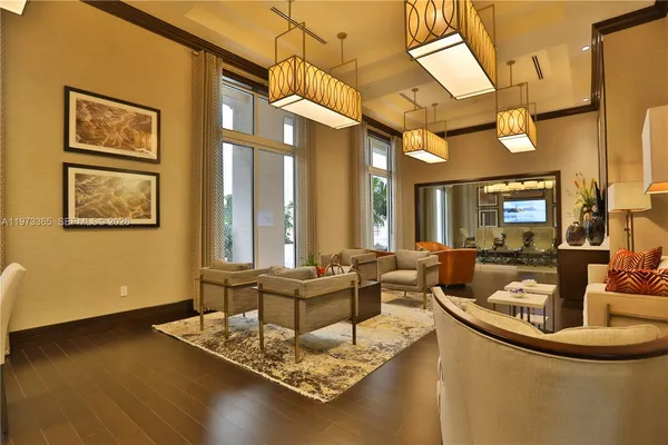 a living room with fireplace furniture and a large window
