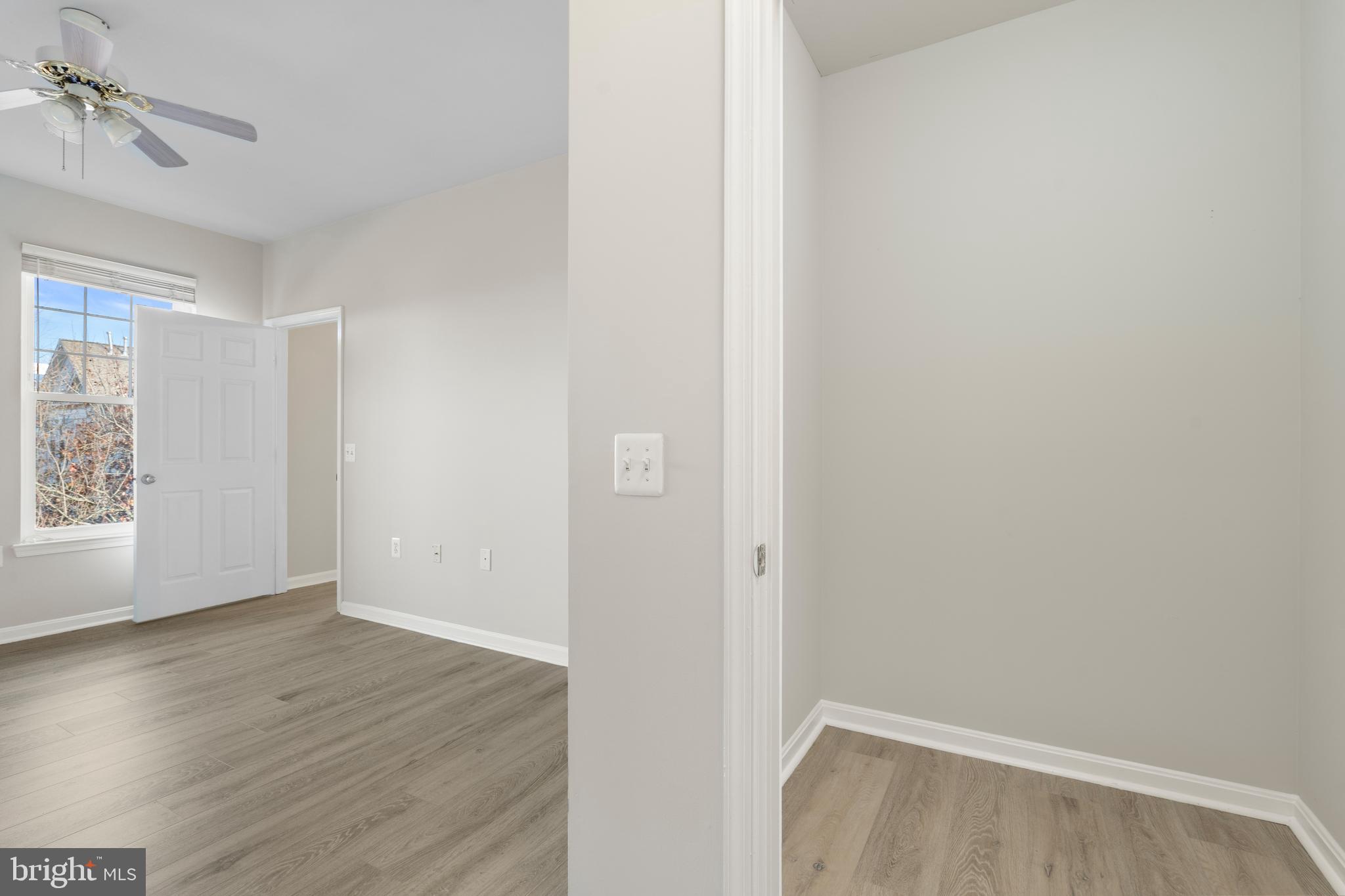 3851 Aristotle Court, Unit 1402 Fairfax, VA 22030 - Photo 17 of 31 a view of room with hardwood floor and window