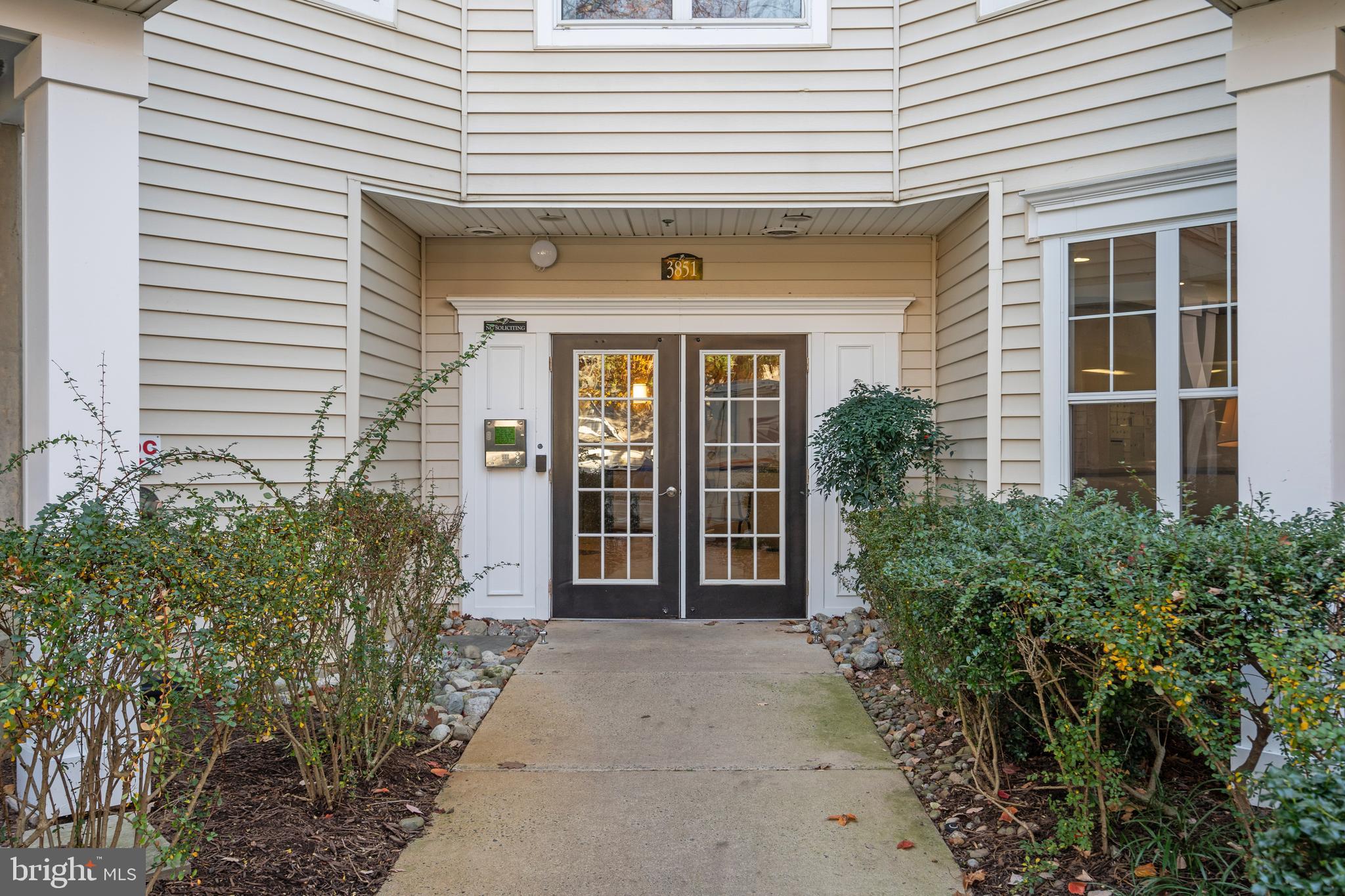 3851 Aristotle Court, Unit 1402 Fairfax, VA 22030 - Photo 2 of 31 a front view of a house with garden