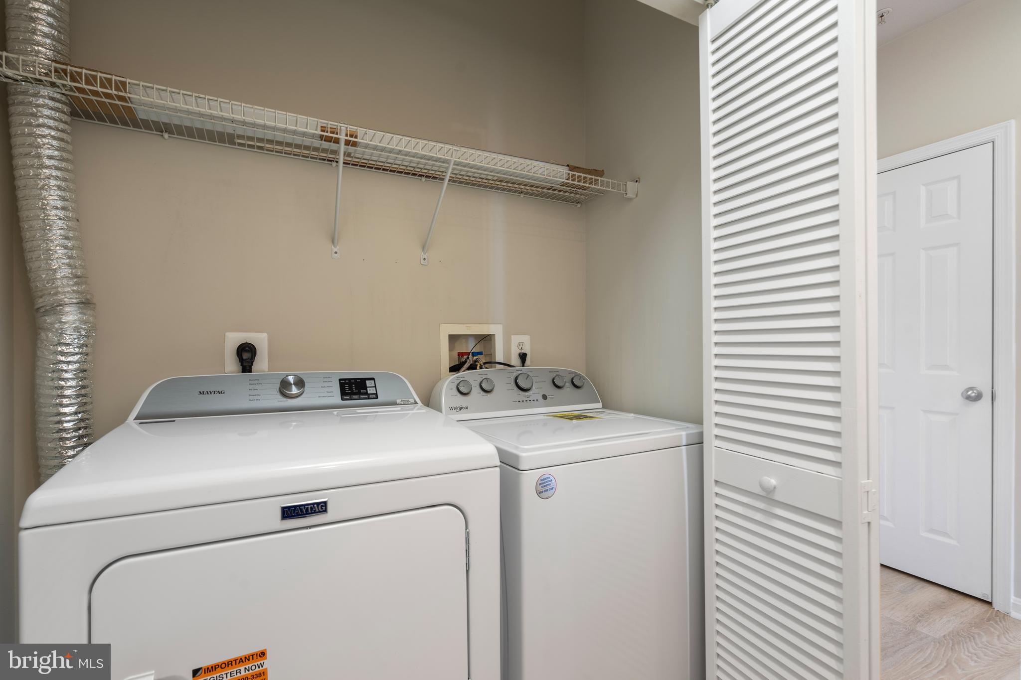 3851 Aristotle Court, Unit 1402 Fairfax, VA 22030 - Photo 21 of 31 a utility room with dryer and washer