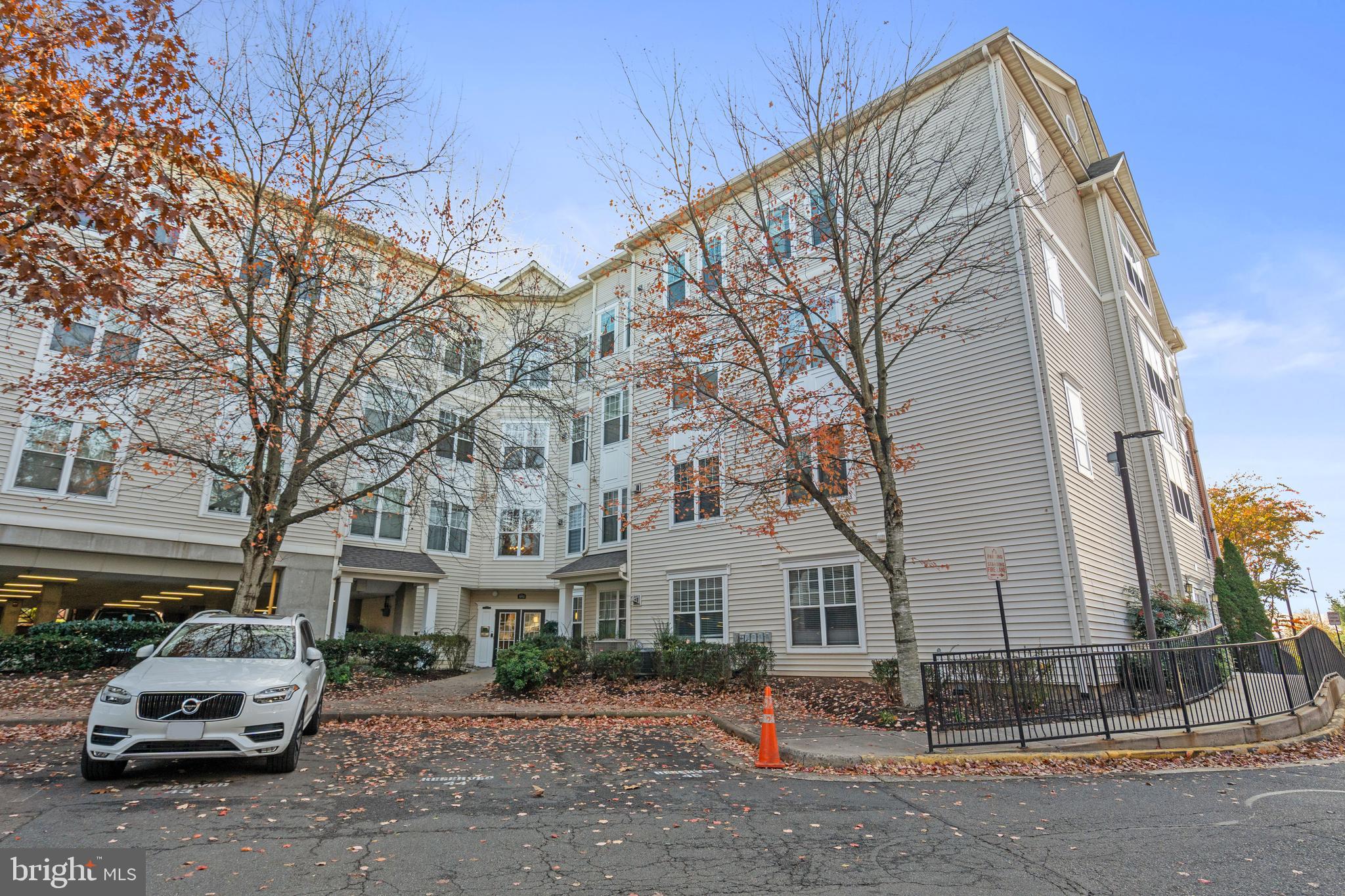 3851 Aristotle Court, Unit 1402 Fairfax, VA 22030 - Photo 28 of 31 a car parked in front of a white house
