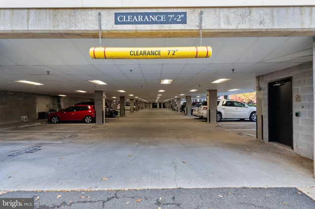 a view of a building with car parked