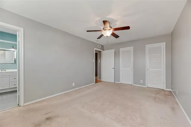 a view of a big room with carpet