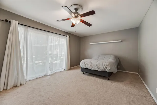 a living room with a bed and a chandelier