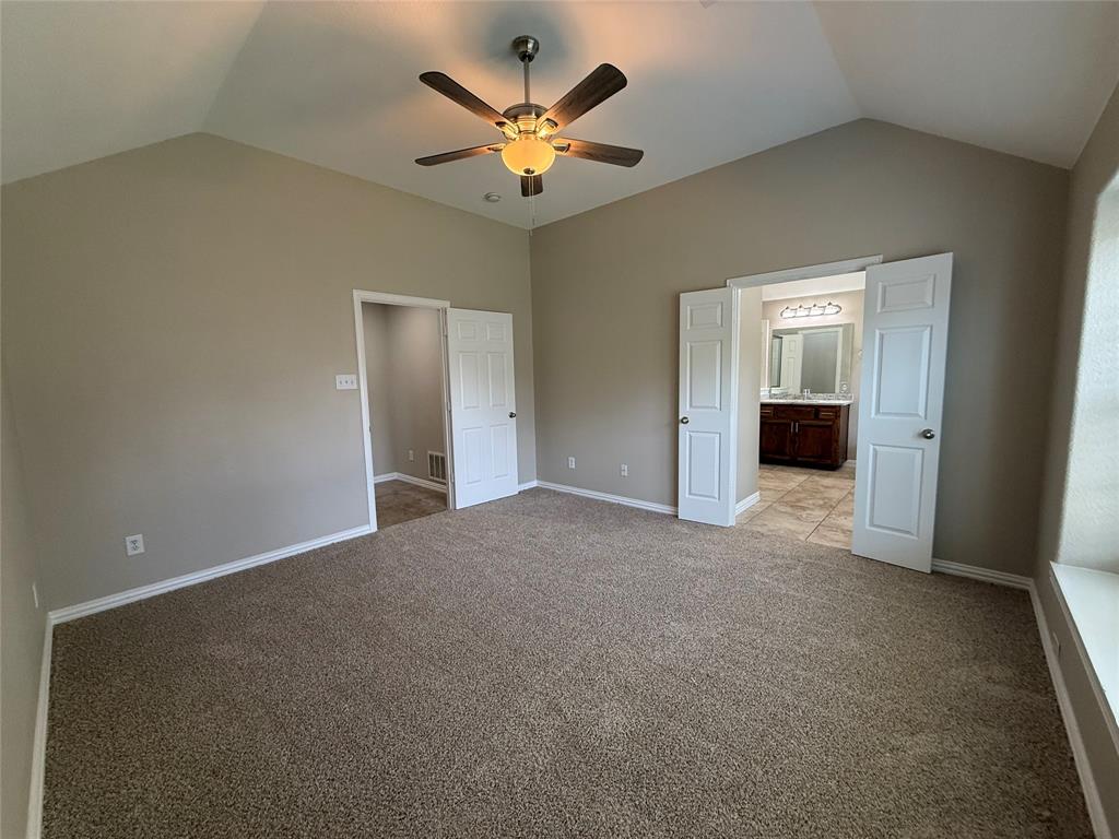 108 Cole Street Forney, TX 75126 - Photo 23 of 39 an empty room with closet and ceiling fan