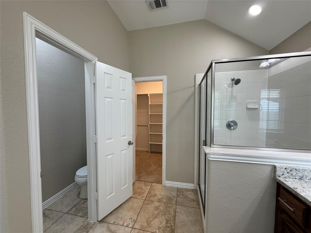 108 Cole Street Forney, TX 75126 - Photo 27 of 39 a bathroom with a shower and a toilet