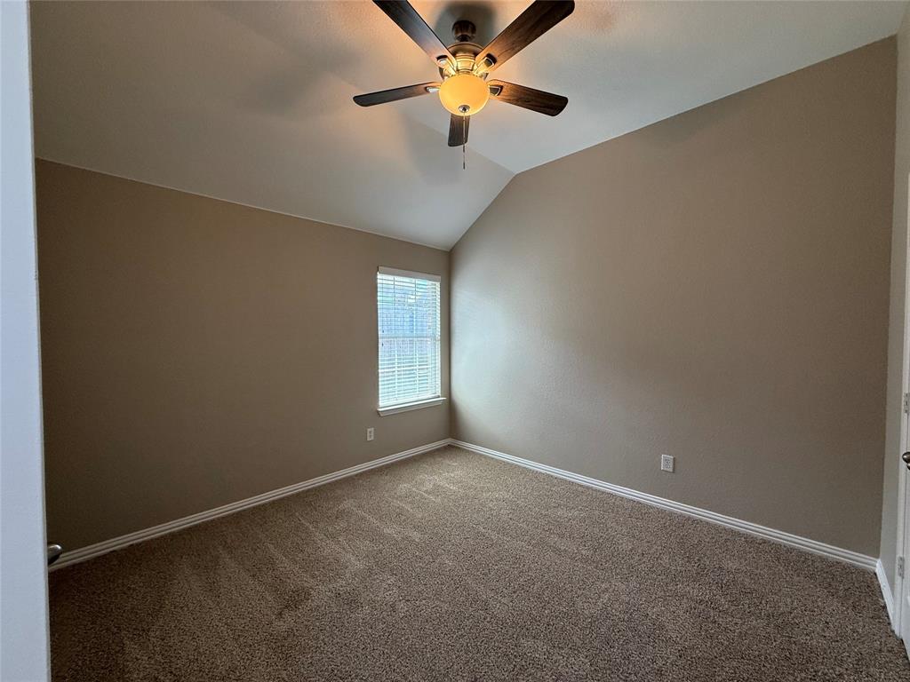 108 Cole Street Forney, TX 75126 - Photo 29 of 39 an empty room with a window and a fan