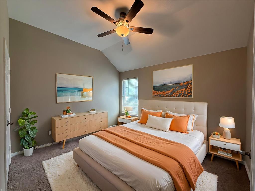 108 Cole Street Forney, TX 75126 - Photo 31 of 39 a bedroom with bed and a chandelier