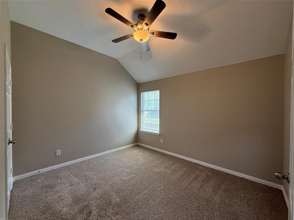 108 Cole Street Forney, TX 75126 - Photo 32 of 39 an empty room with a window and a fan