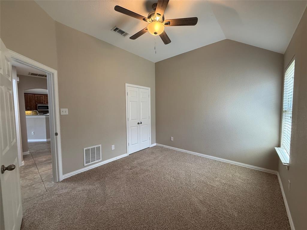 108 Cole Street Forney, TX 75126 - Photo 33 of 39 an empty room with closet and windows