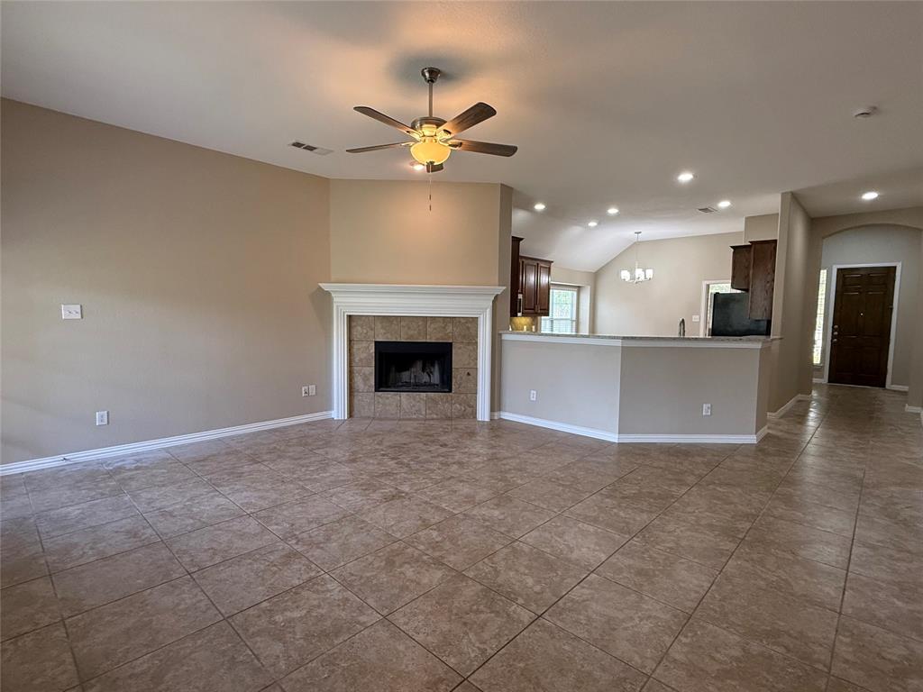 108 Cole Street Forney, TX 75126 - Photo 7 of 39 a view of a kitchen with a sink and a fireplace