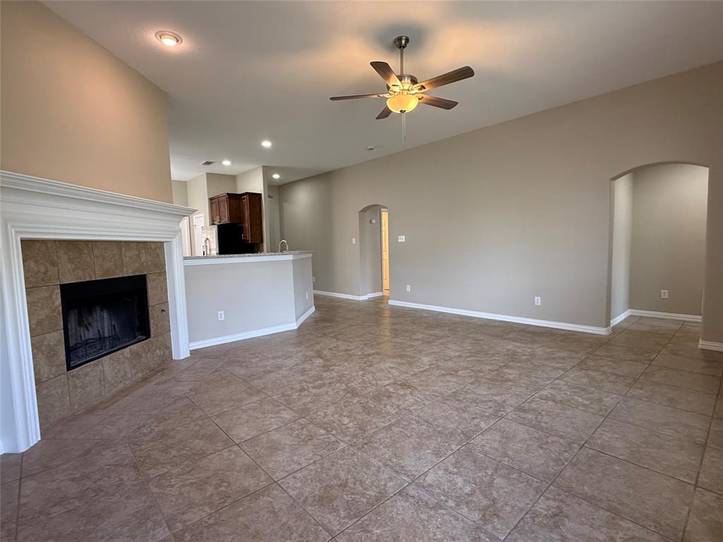 108 Cole Street Forney, TX 75126 - Photo 8 of 39 a view of an empty room with a fireplace