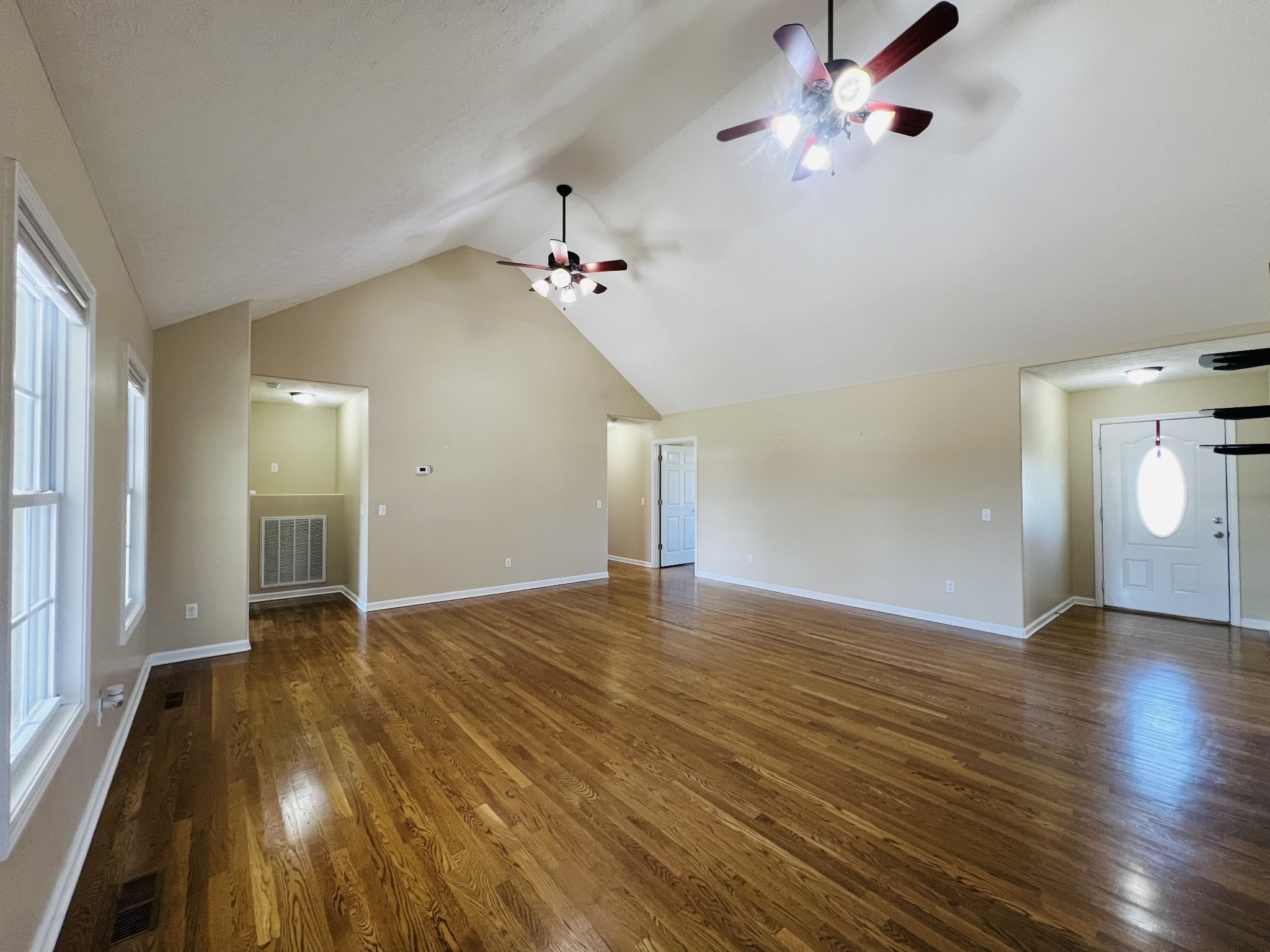 663 Jackson Road Portland, TN 37148 - Photo 7 of 32 a view of an empty room with window and wooden floor