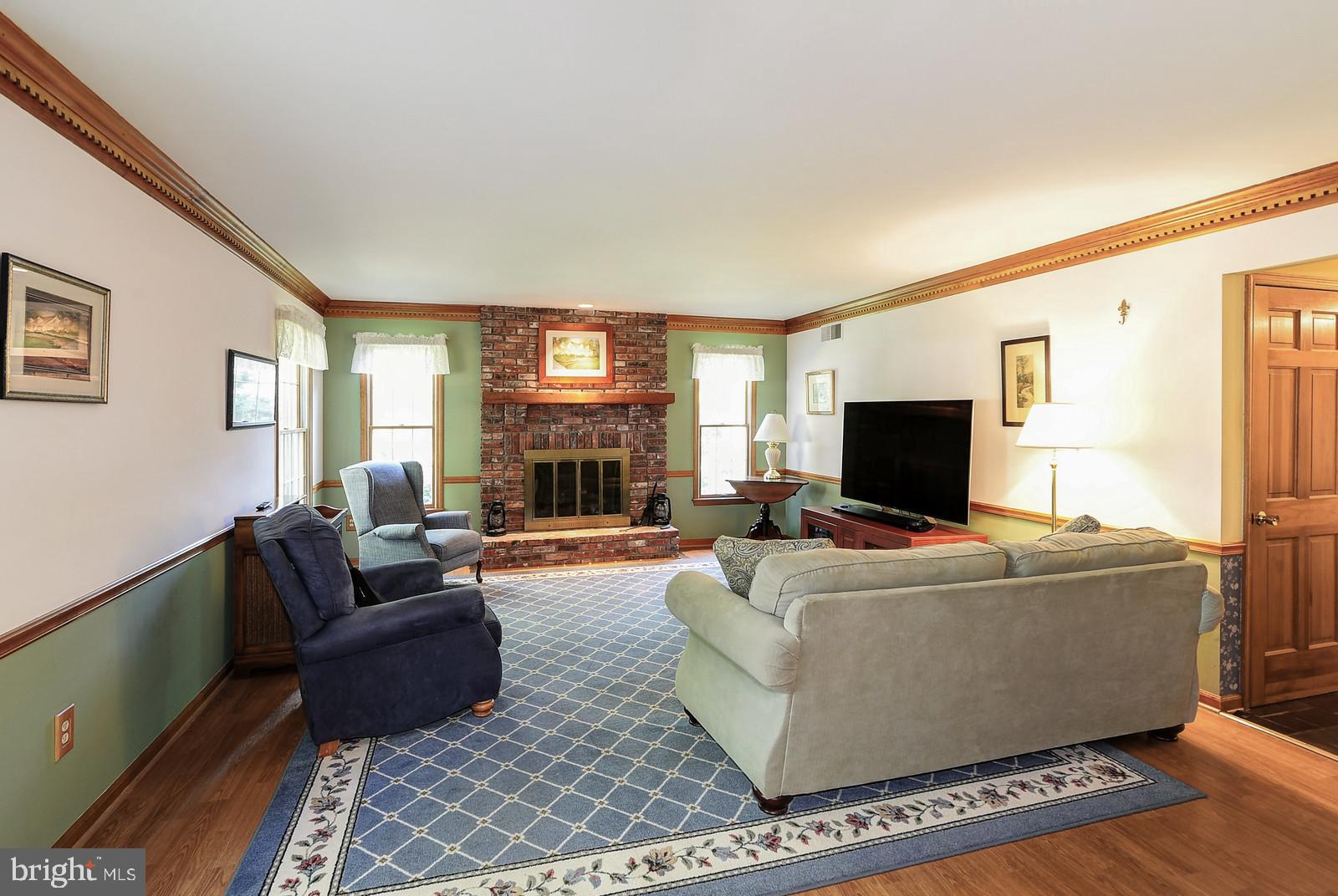 4 Azalea Way Hamilton, NJ 08690 - Photo 3 of 30 Living Rm with Fireplace and Dental Crown Molding