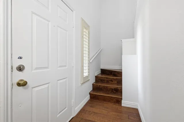 a view of staircase with white walls