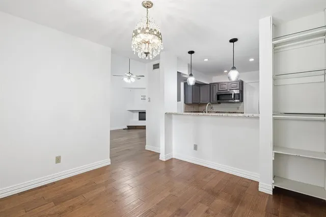 a view of a kitchen with a refrigerator and dishwasher