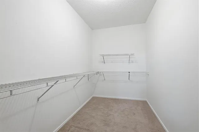 a view of a room with racks on the wall