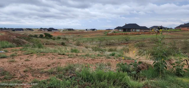 a view of a lake with a yard