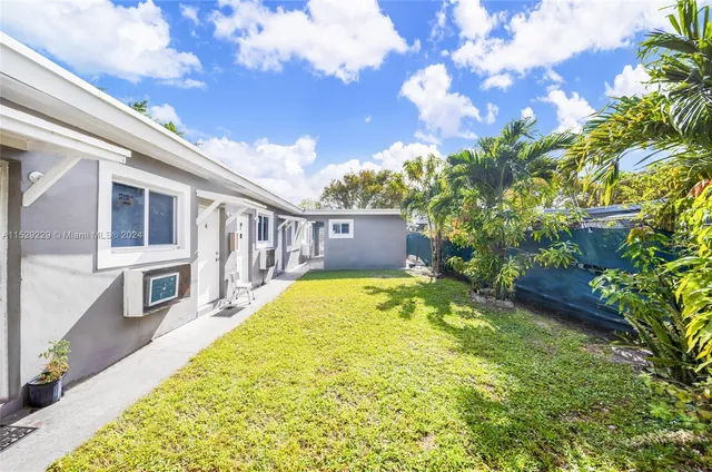 a view of a backyard with plants
